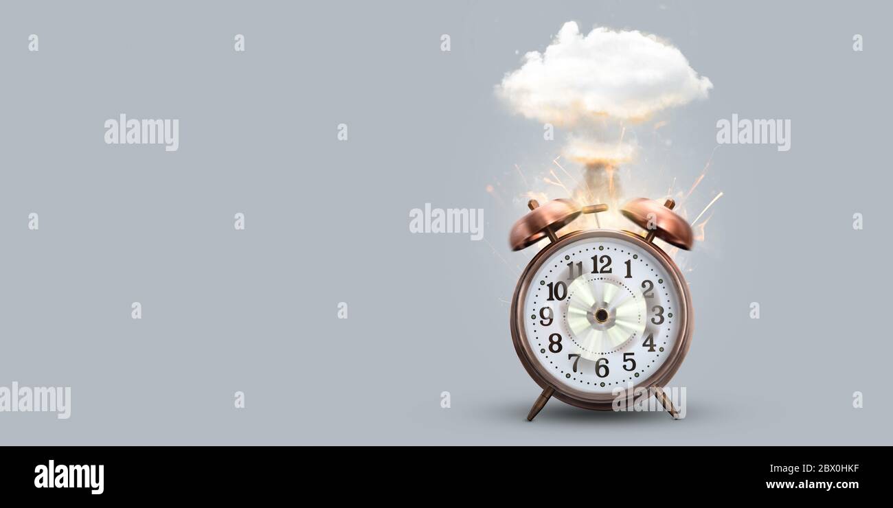 Funny alarm clock exploding with a mushroom cloud Stock Photo