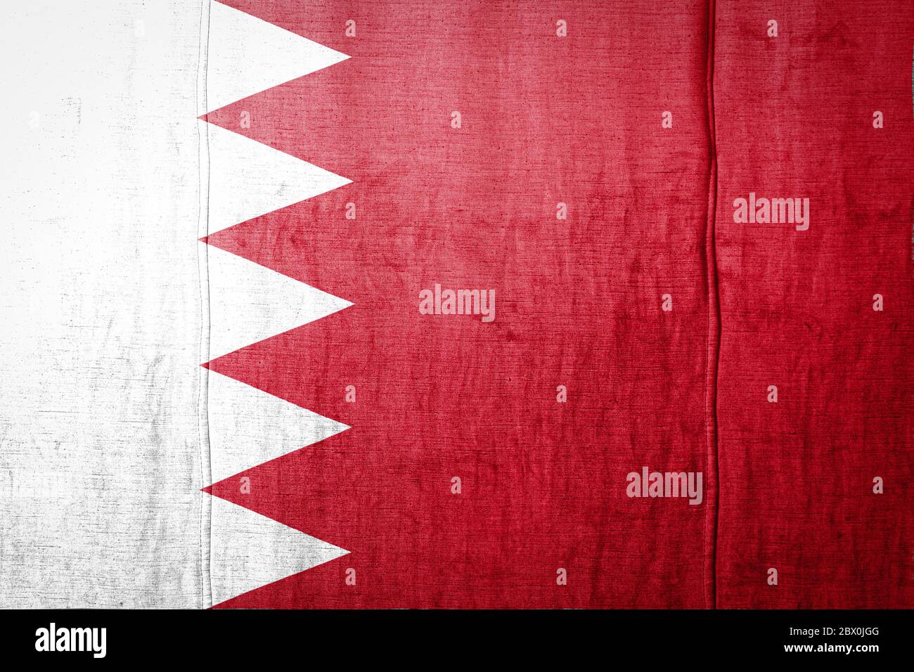 National flag of Bahrain depicting in paint colors on old clothl. Flag ...