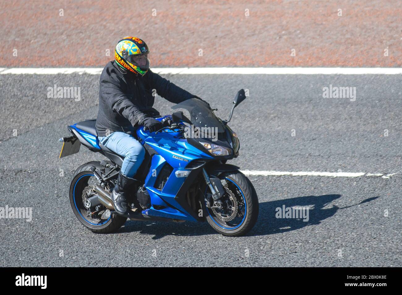 KAWASAKI Z1000SX Motorbike rider; two wheeled transport, motorcycles, vehicle, roads, motorbikes, bike riders motoring on the M6 motorway Chorley, UK Stock Photo