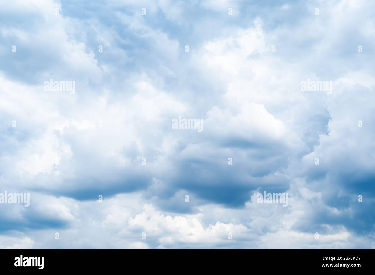 dark blue rainy clouds in sky on spring day Stock Photo