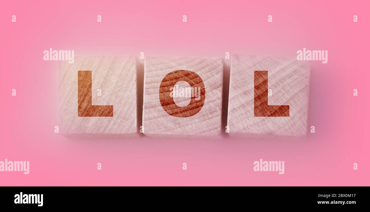 A Pretty Young Teen Happily Holding Rustic Alphabet Blocks With Her  Text-message Abbreviation: LOL (meaning Laughing Out Loud). On A White  Background. Stock Photo, Picture and Royalty Free Image. Image 26610107.