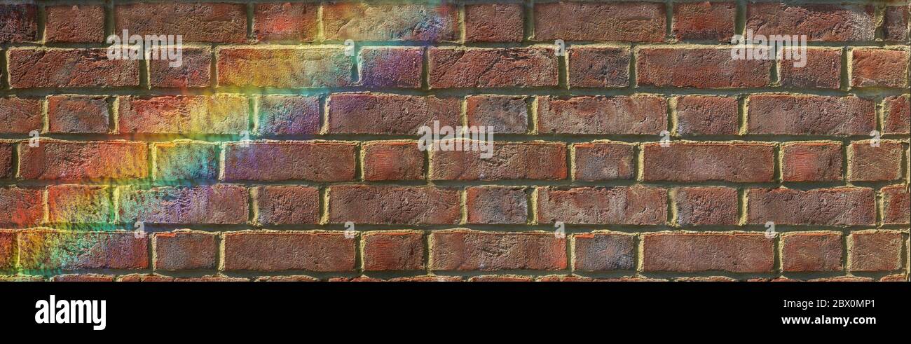Inspirational Rainbow rustic brick wall message background banner - Wide natural coloured grunge brick wall with a flash of rainbow across left corner Stock Photo