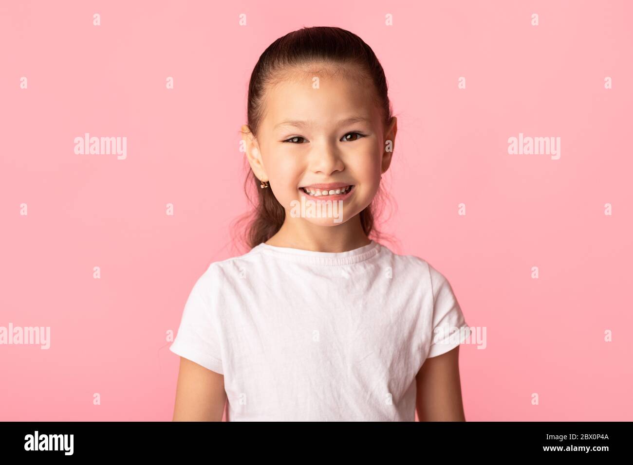Happy asian kid posing and looking at camera Stock Photo Alamy