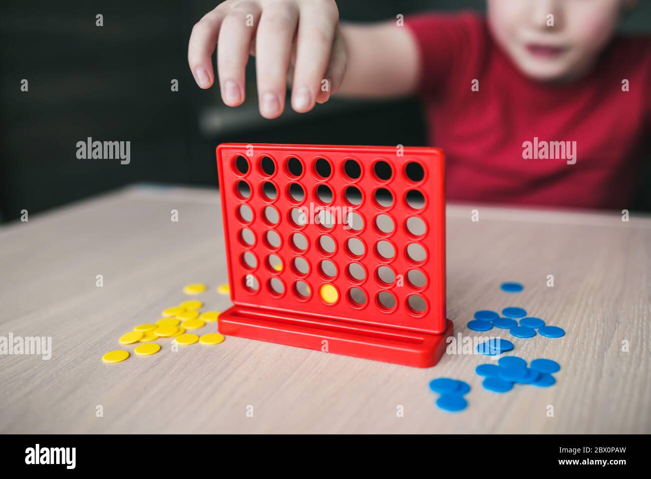 Intellectual board strategy game "four in a row" a game for the whole