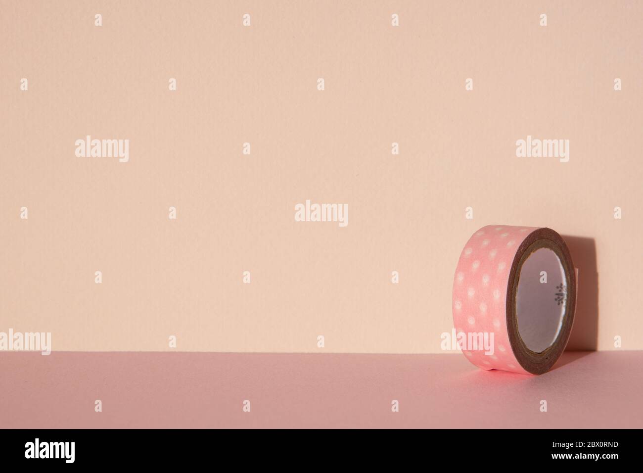 pink color background and pink tape for decoration. Stock Photo