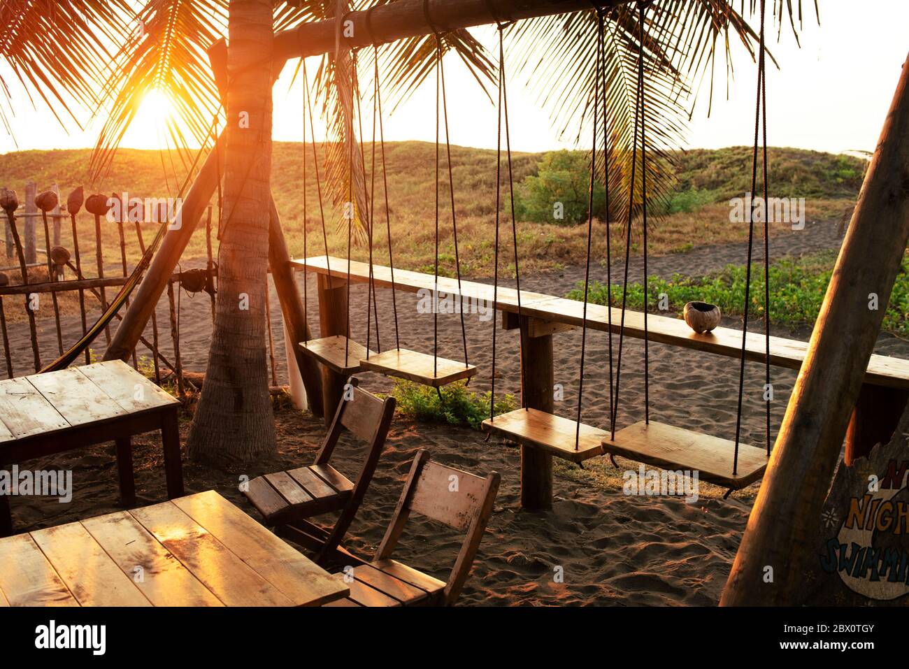 Rustic beach bar with swing seats. El Paredón, Guatemala Stock Photo