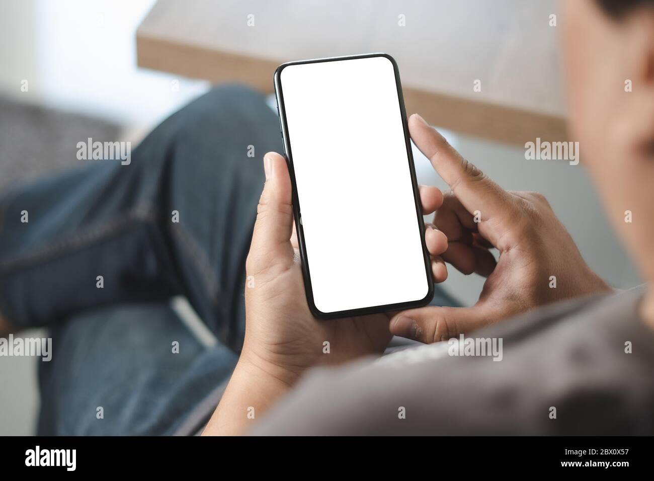 Top view Mockup image hand using a smartphone man Holding Cell Phone With  Blank Screen Stock Photo - Alamy