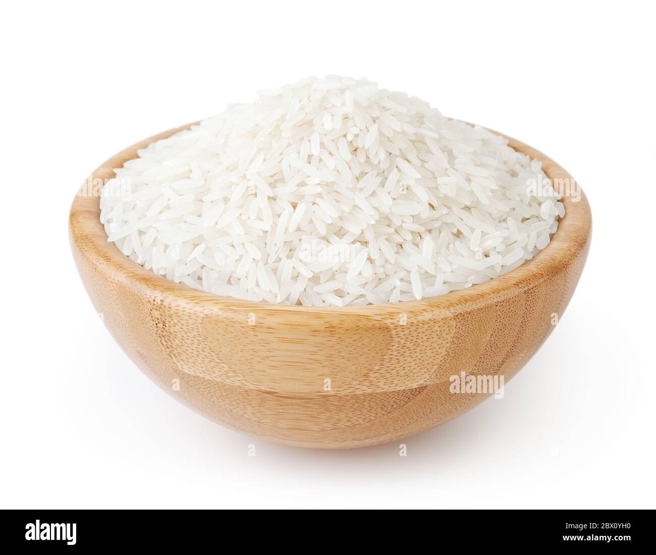 White long-grain rice in wooden bowl isolated on white background Stock Photo