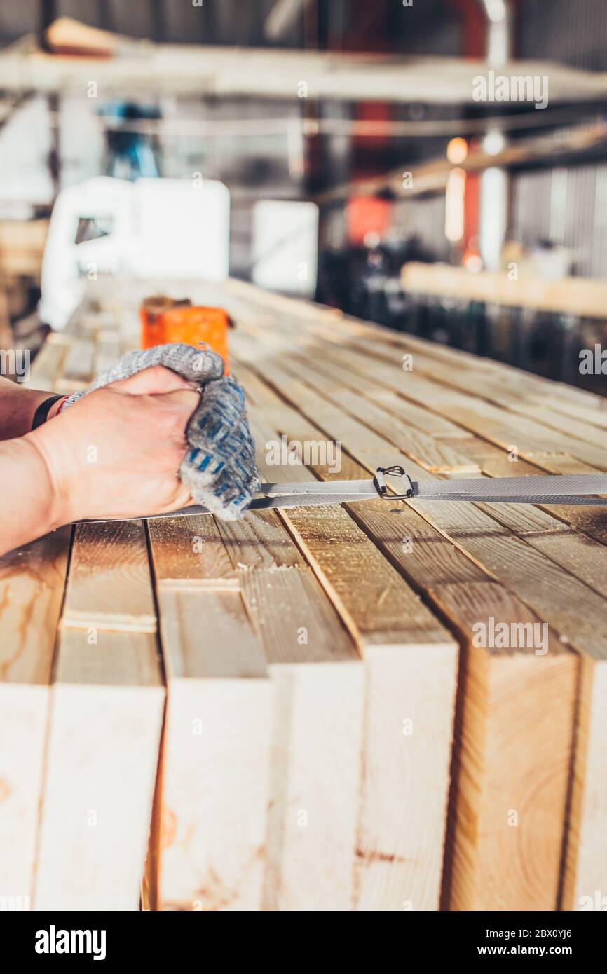 Sawmill women strapping boards production of laminated veneer