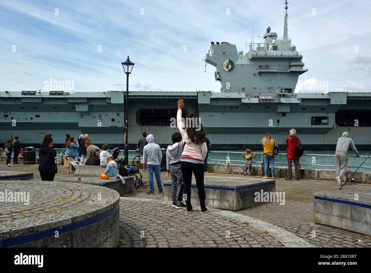 HMS Queen Elizabeth passes historic Old Portsmouth as it arrives back in base to resupply ahead of further sea tests and flight trials with F35 Lightning jets. Stock Photo