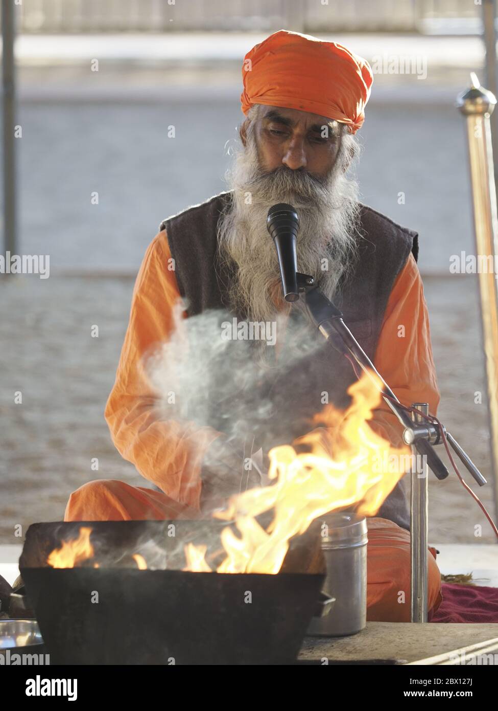 Bishnoi Priest undertaking fire ceremonyJajiwal Dune Rajasthan, India PE000029 Stock Photo
