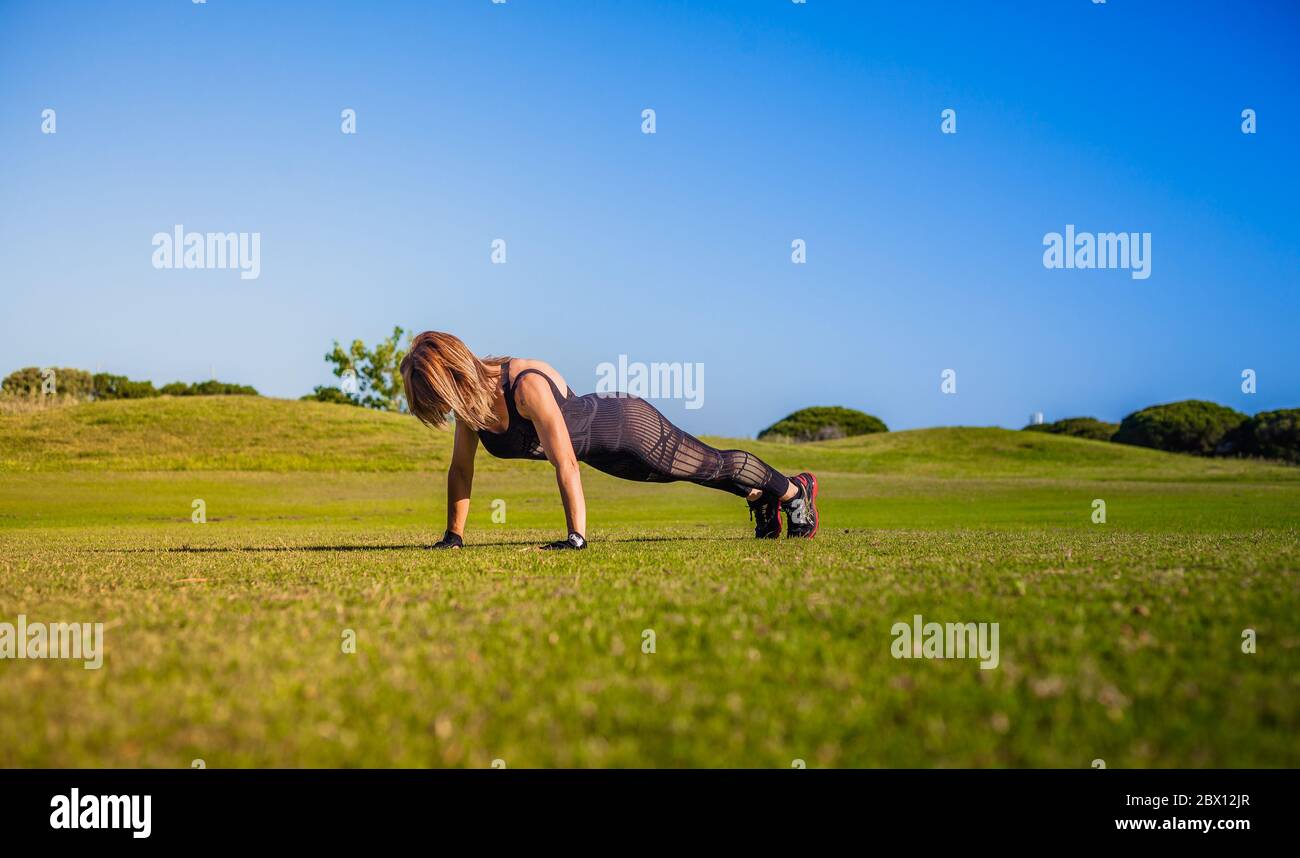 Active woman doing sport in the nature Stock Photo