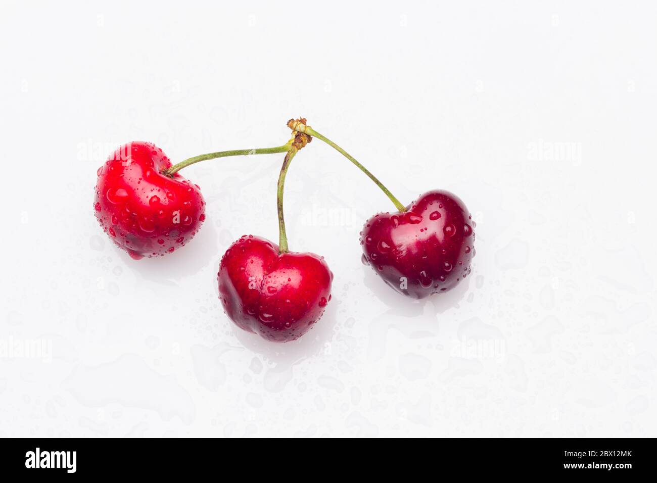 Cherries of cherry red color, almost garnet red, vitamin-rich fruit, eaten raw ideal for desserts of jams, jams, juices. Full of vitamins and very hea Stock Photo