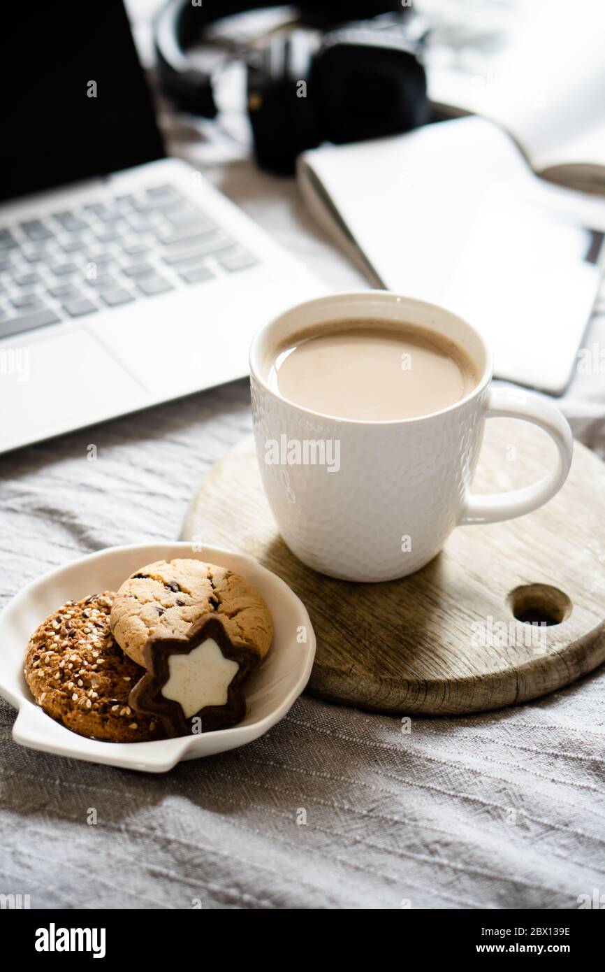 Download Real Home Workplace Laptop With Cup Of Coffee With Cookies On Bed With Cozy Blanket Stock Photo Alamy