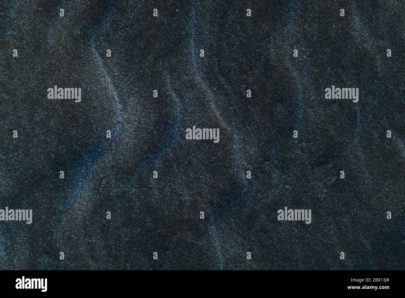 Beach black sand texture and pattern background Stock Photo - Alamy