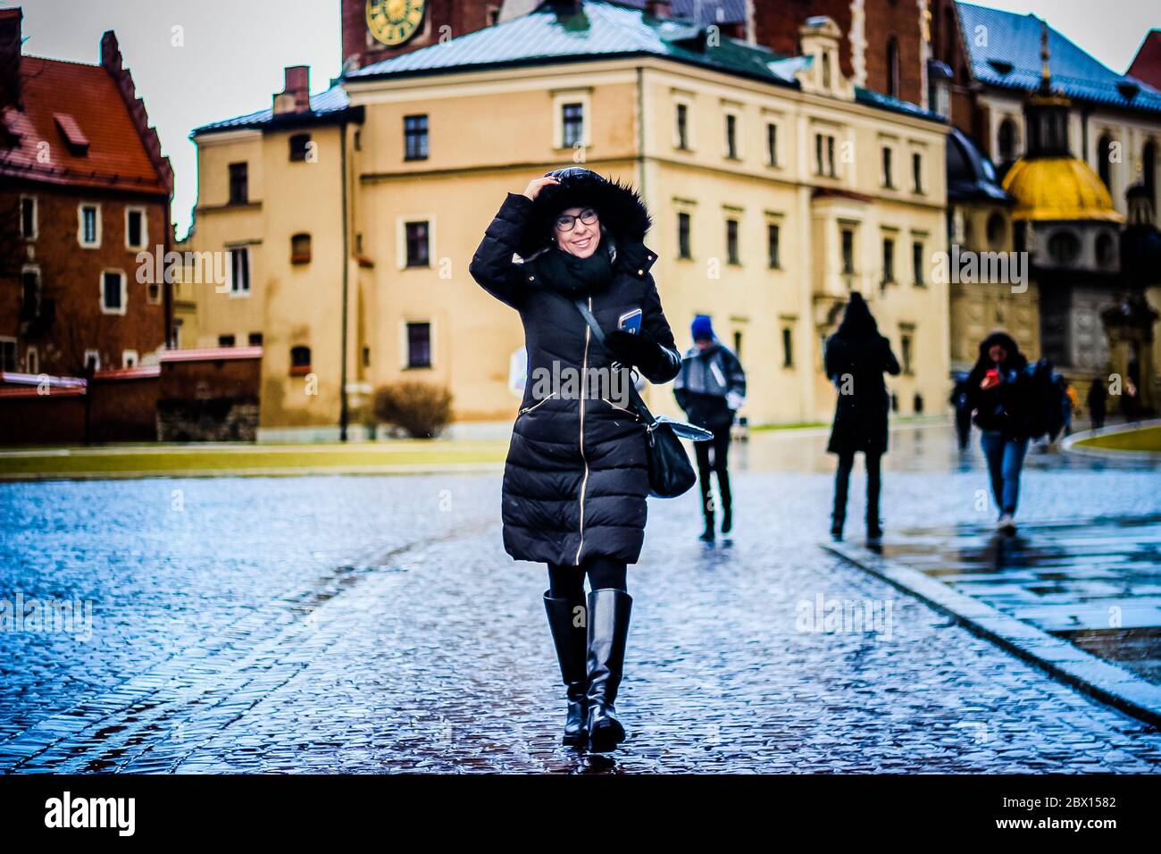 Woman walking down Royal Wawel Castle - Krakow - Poland - Europe Stock Photo