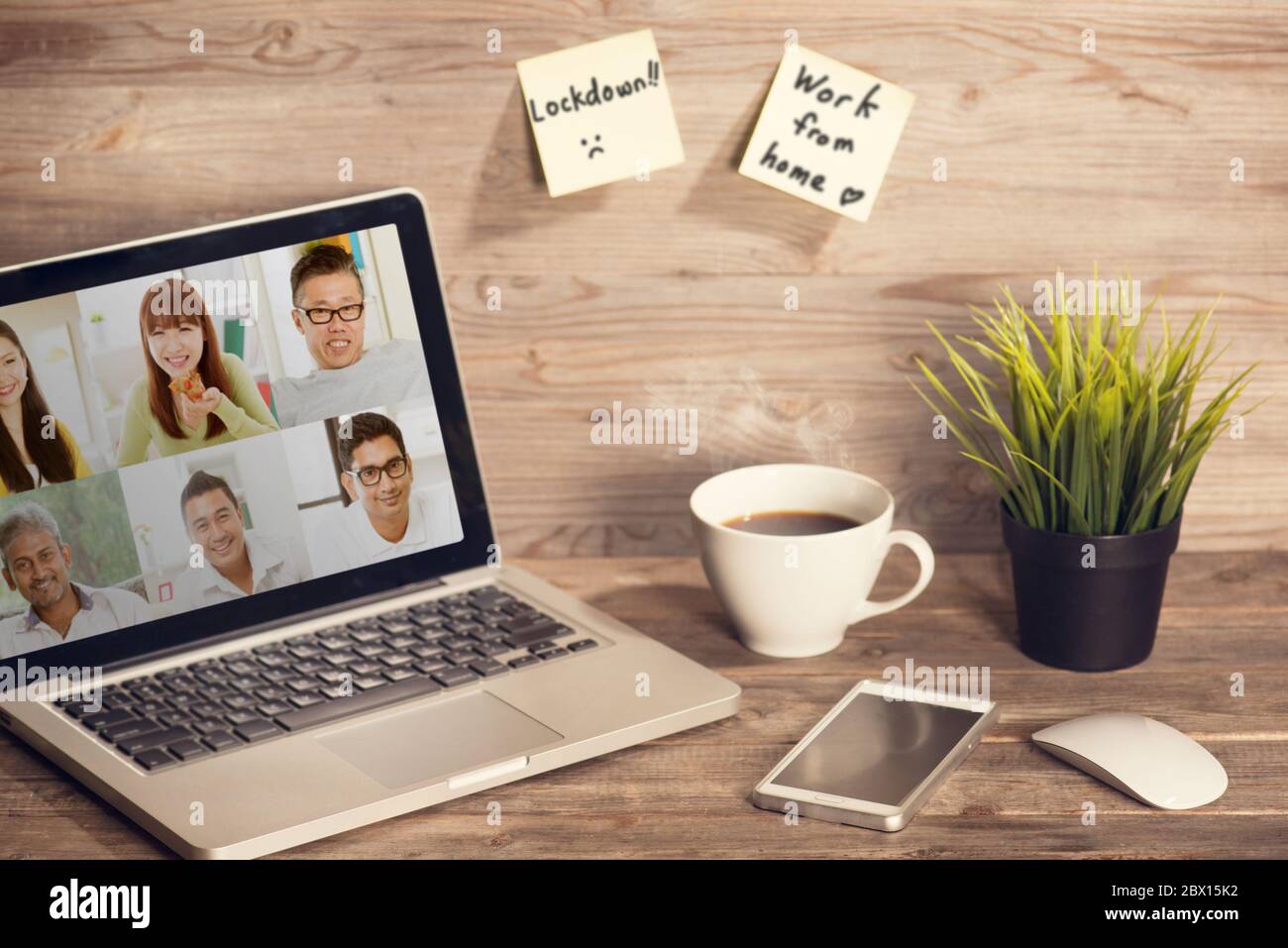 Work from home, video conferencing with coworkers due to Covid 19 pandemic lockdown. Stock Photo