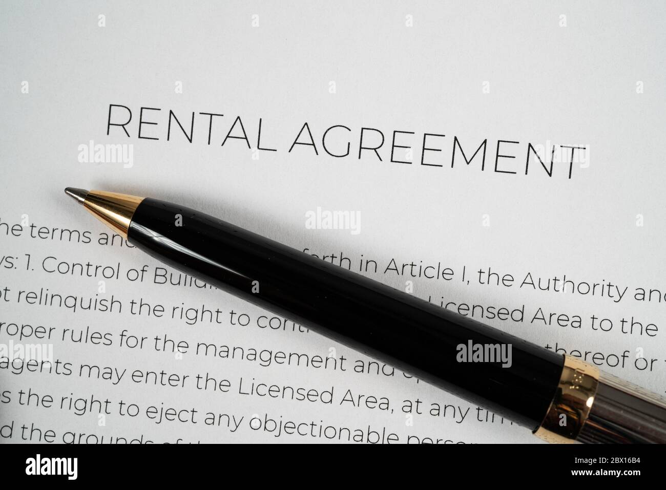 Pen on top of a rental agreement ready to be signed Stock Photo