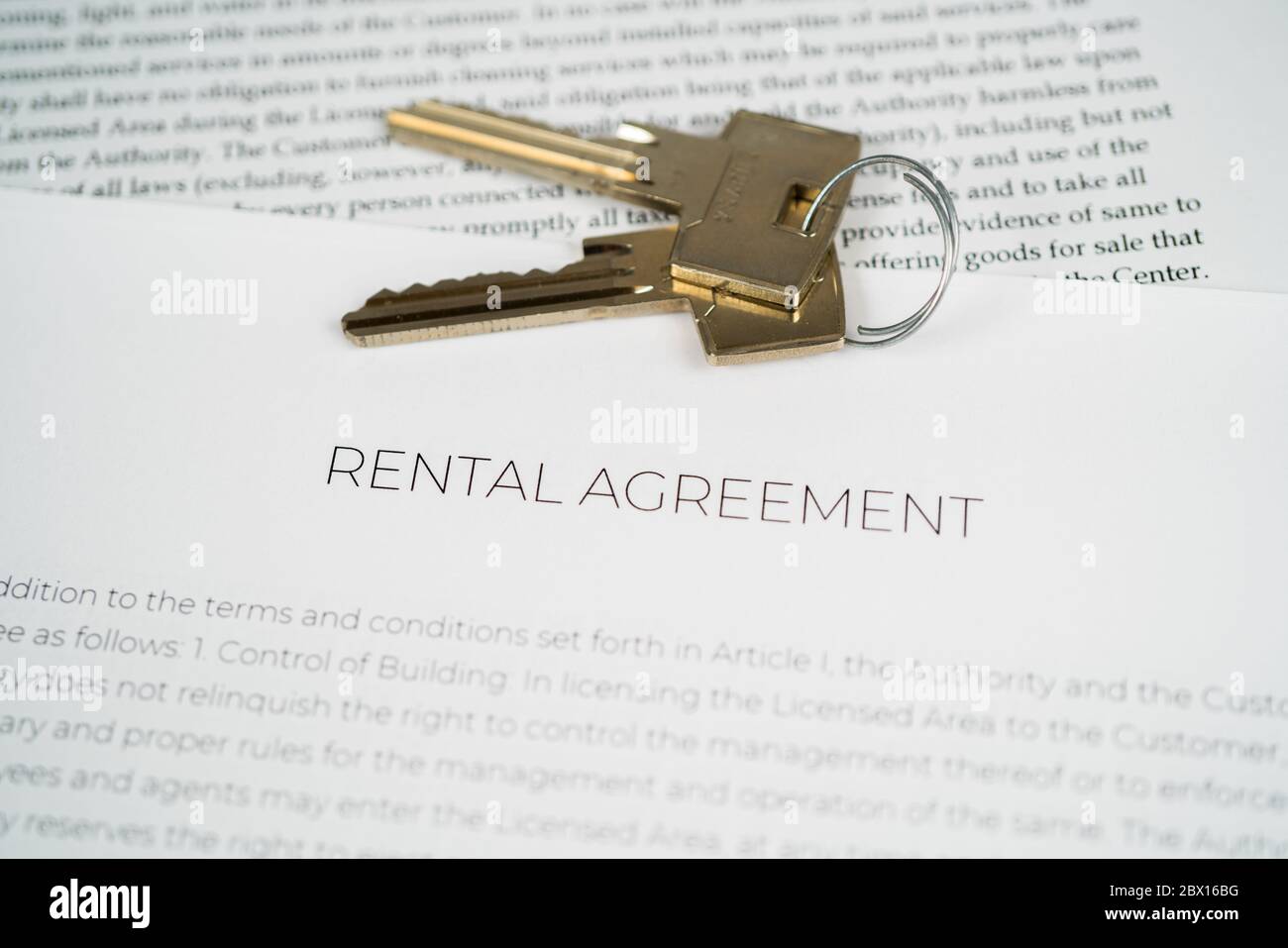 House keys on top of a Rental agreement Stock Photo
