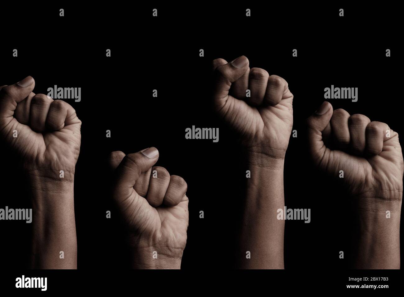 Concept against racism or racial discrimination by showing with hand gestures fist or solidarity Stock Photo