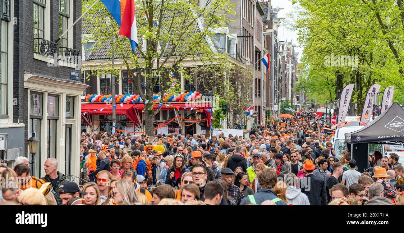 Amsterdam, The Netherlands, April 27 2018, Tourists and locals visiting the capital at the Prinsengracht to celebrate Kingsday Stock Photo