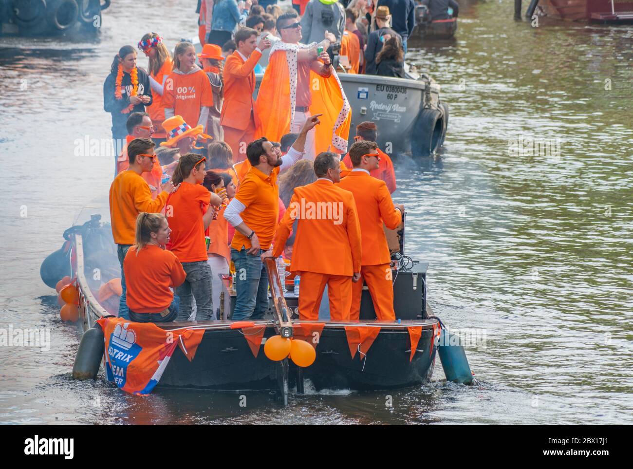 Amsterdam, The Netherlands, April 27 2018, Tourists and locals sailing on the Prinsengracht to celebrate Kingsday Stock Photo