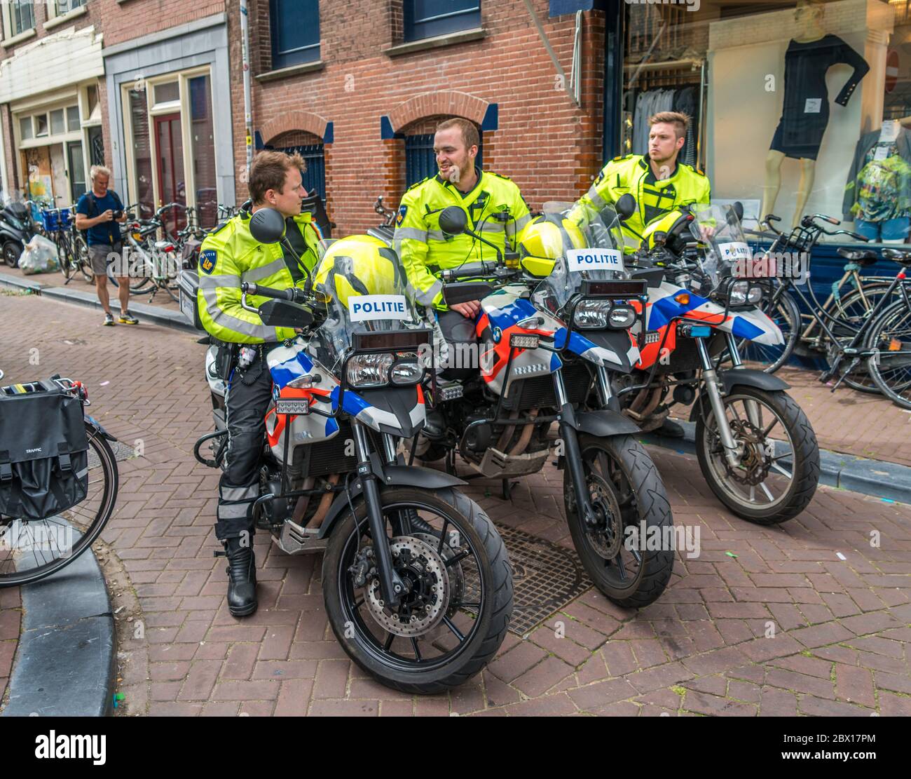 Amsterdam, August 5 2017: Police motor offices protecting visitors of the 2017 Canal parade on the Prinsengracht in the center of Amsterdam Stock Photo