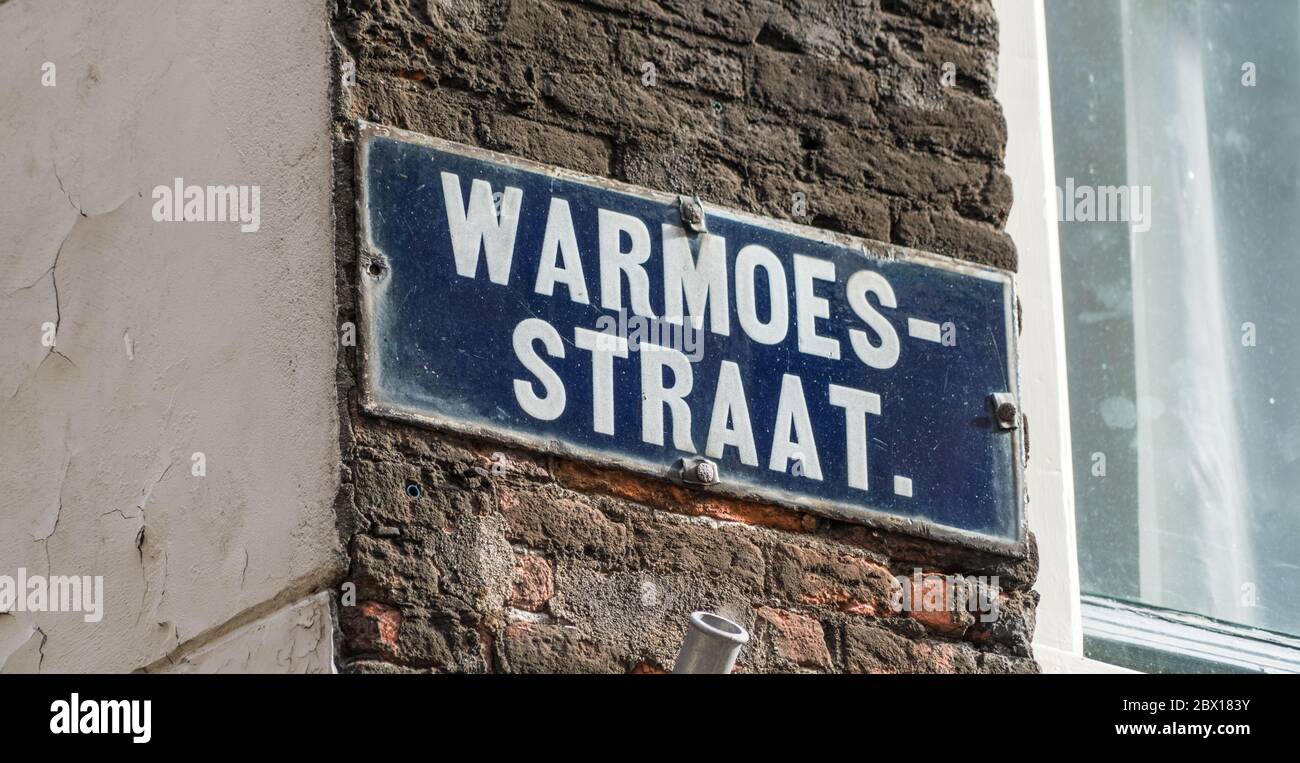 Street sign Warmoestraat in the center of Amsterdam Stock Photo