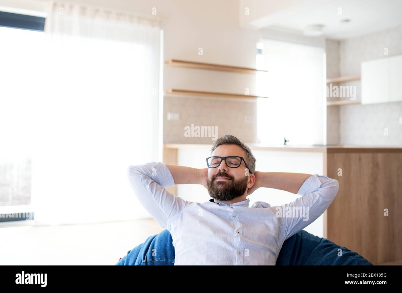 Man sitting on bean bag hi-res stock photography and images - Alamy