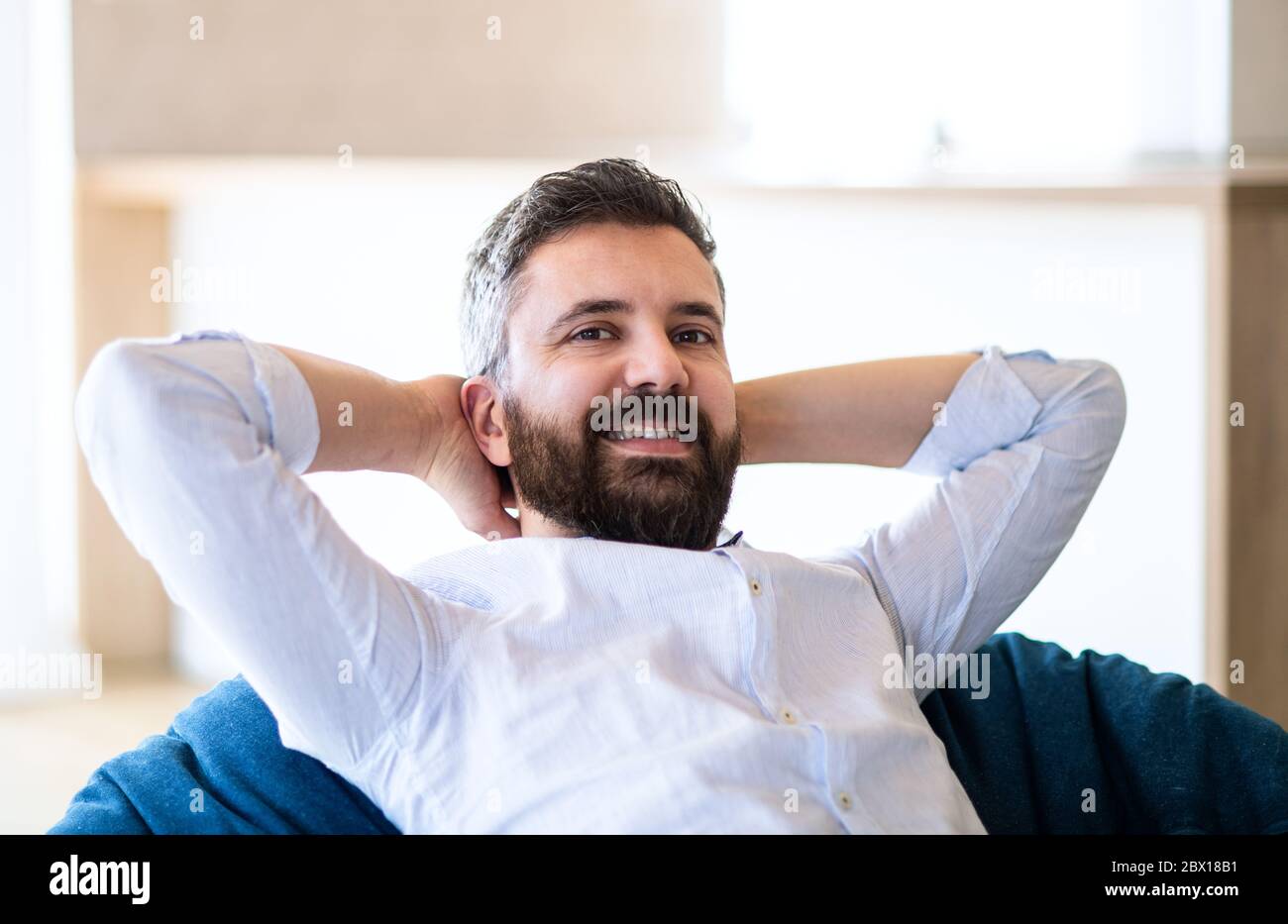 Man sitting on bean bag hi-res stock photography and images - Alamy