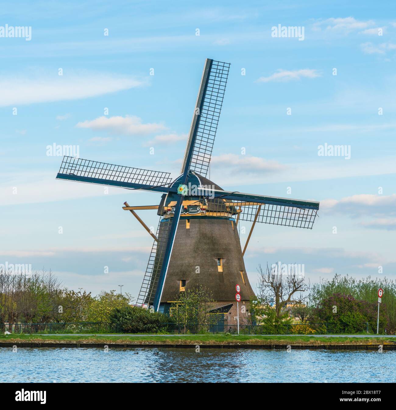 Ouderker aan de Amstel, The Netherlands, April 19, 2017: Authentic Dutch Windmill The Zwaan at the Amstel river near Amsterdam Stock Photo