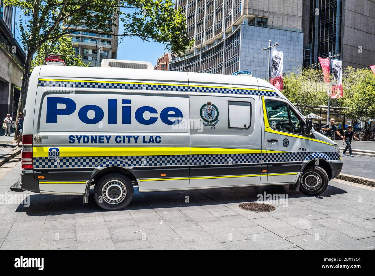 Police van parked on a sidewalk in the center of Sydney Australia