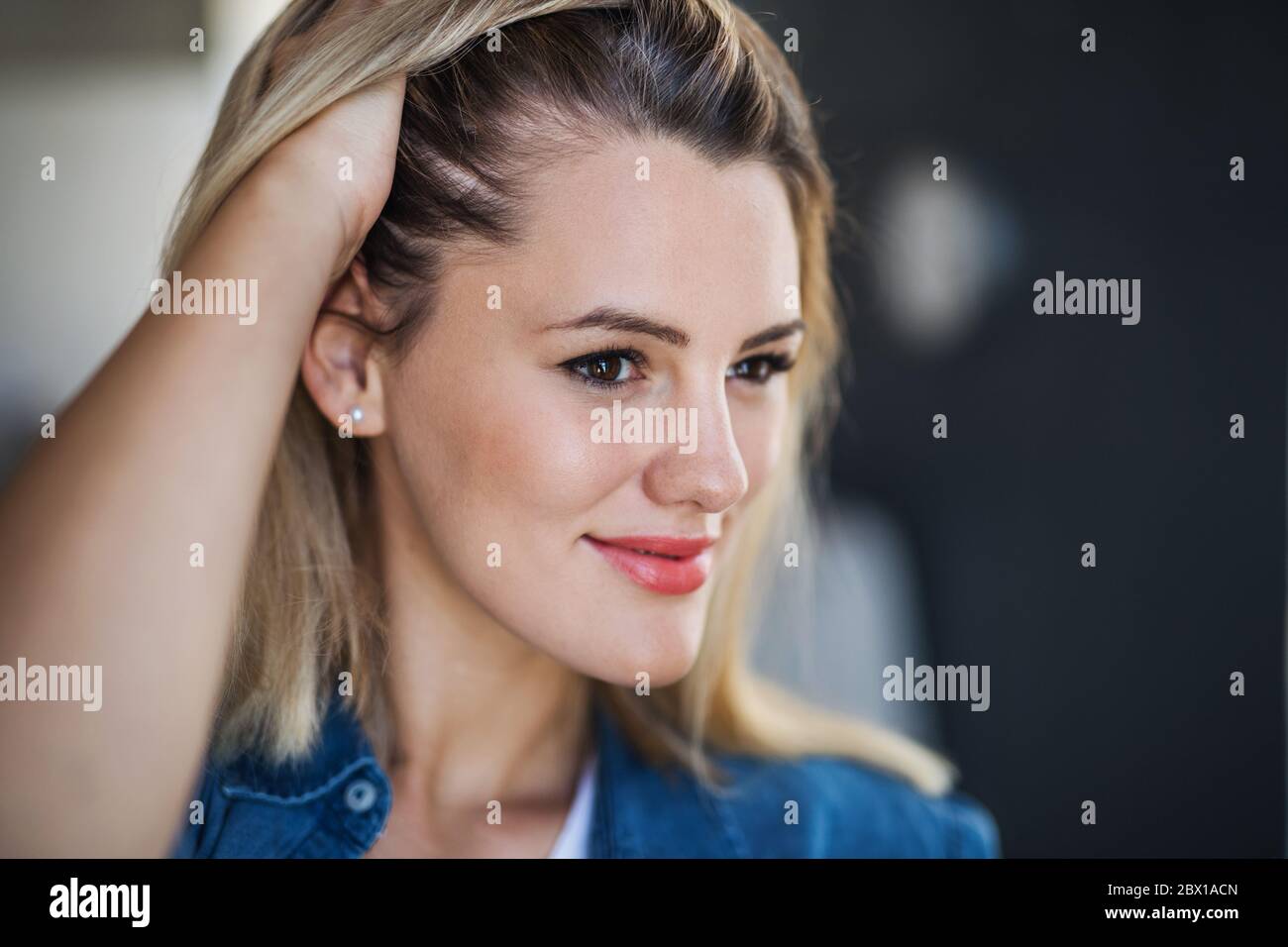 Close-up portrait of happy young woman indoors at home. Stock Photo