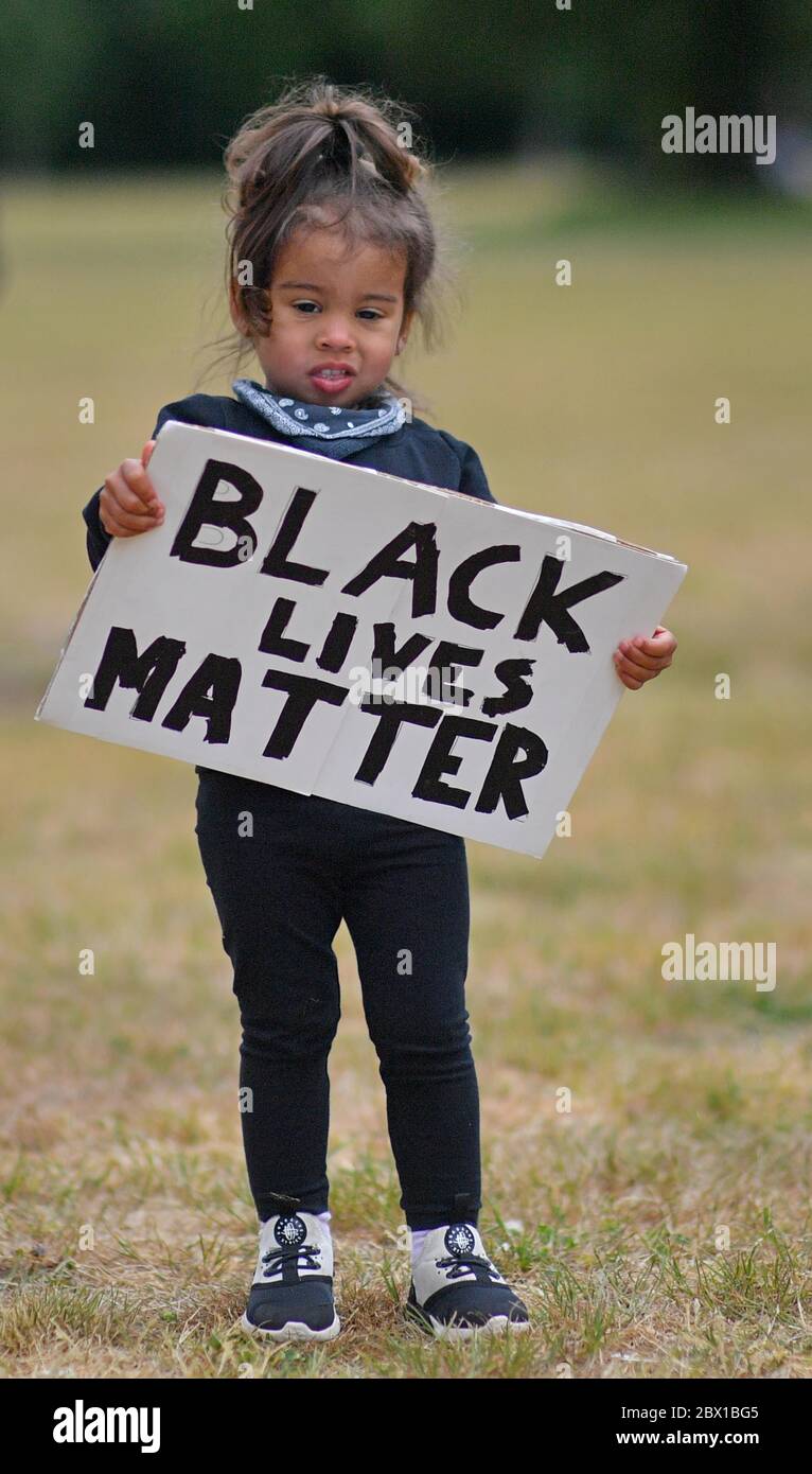 Sicaria, aged 2, during a Black Lives Matter protest rally at Eastville Park in Bristol in memory of George Floyd who was killed on May 25 while in police custody in the US city of Minneapolis. Stock Photo