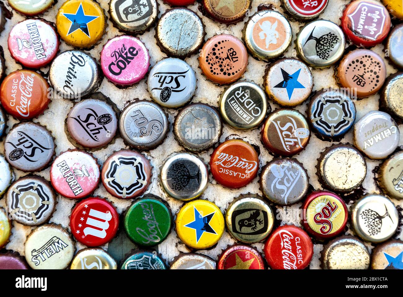 Wall covered with rusty metal bottle caps (The Golden Heart pub