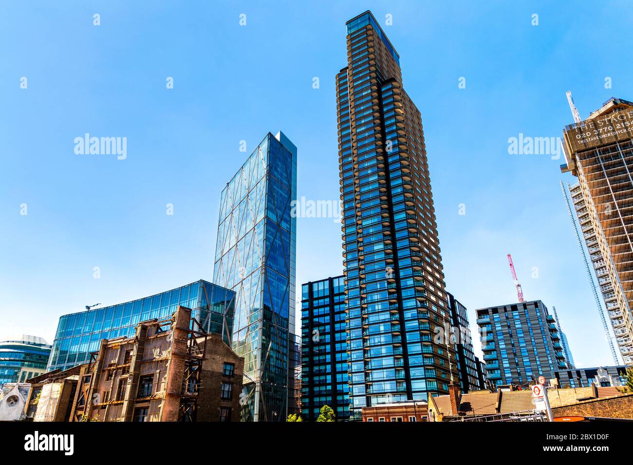 Liverpool Street and Shoreditch skyscrapers, Broadgate Tower and Principal Tower and decrepit buildings in redevelopment area around Commercial St, UK Stock Photo