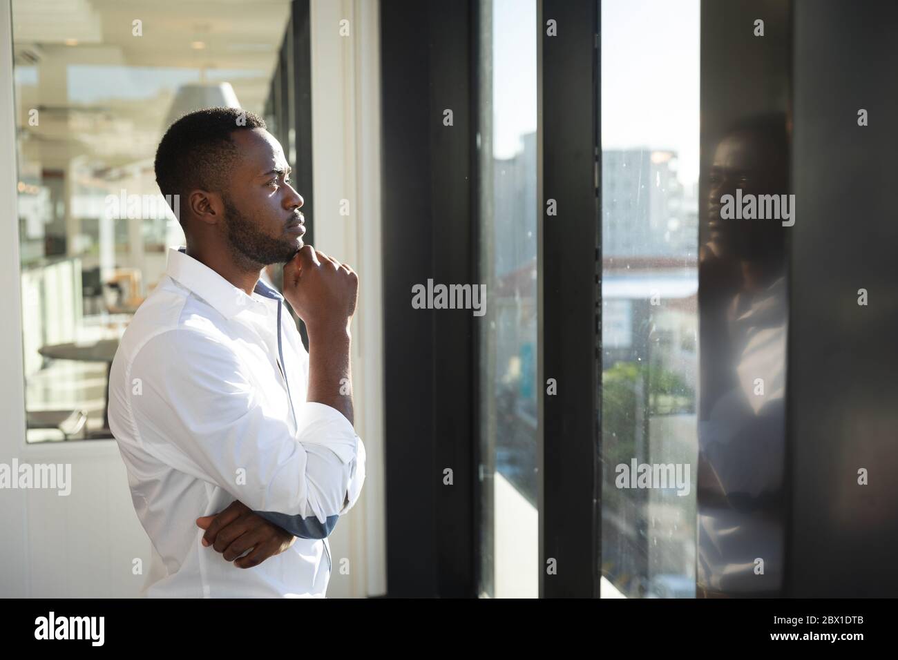 African American business man thoughtful and looking outside Stock Photo