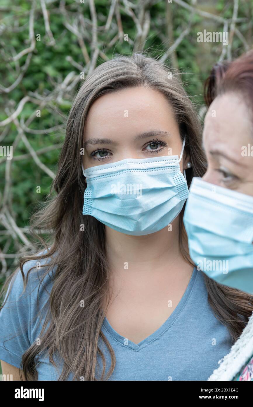 Two young women with face masks hi-res stock photography and images - Alamy