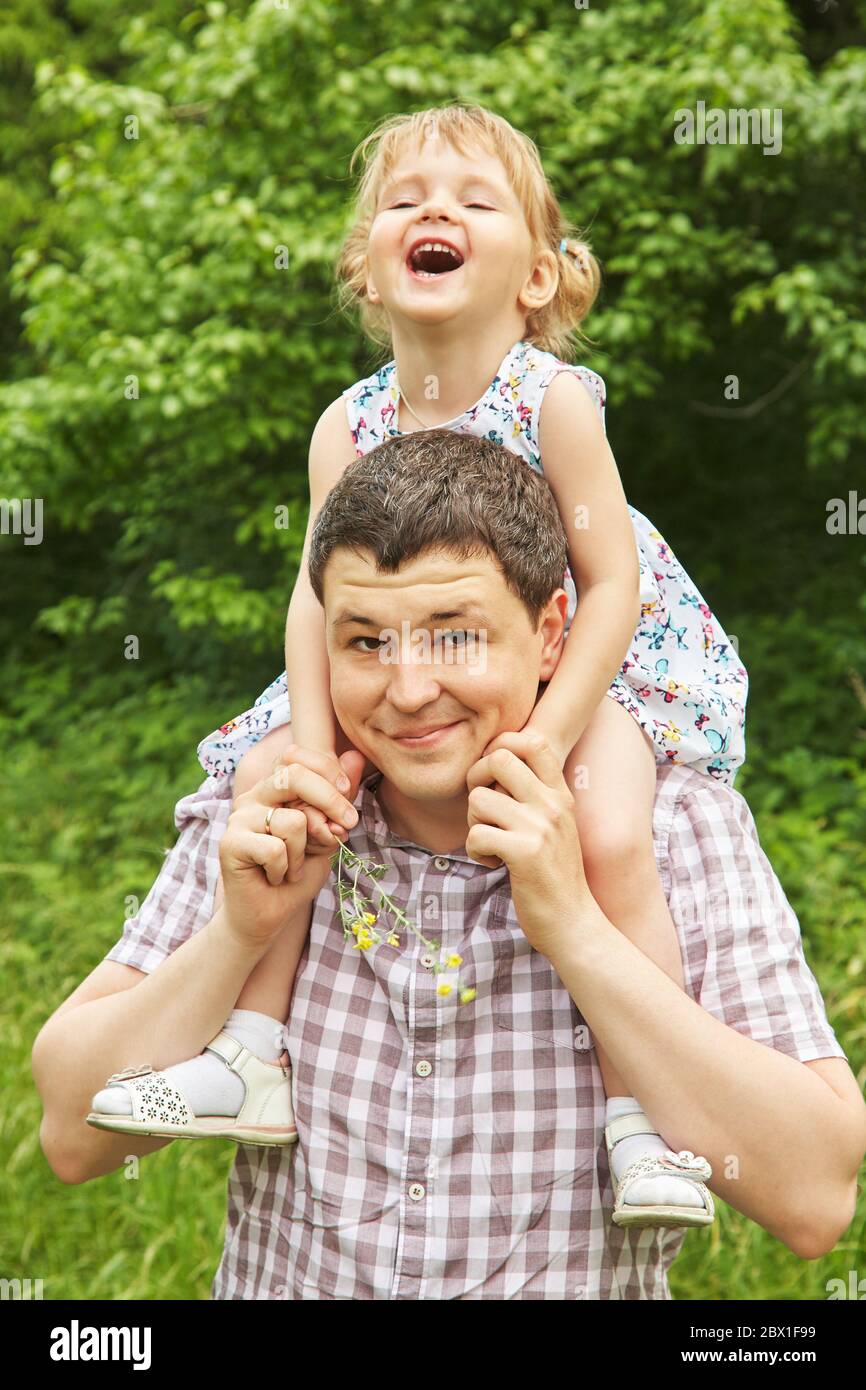 Mom, dad, daughter walking park hi-res stock photography and images - Alamy
