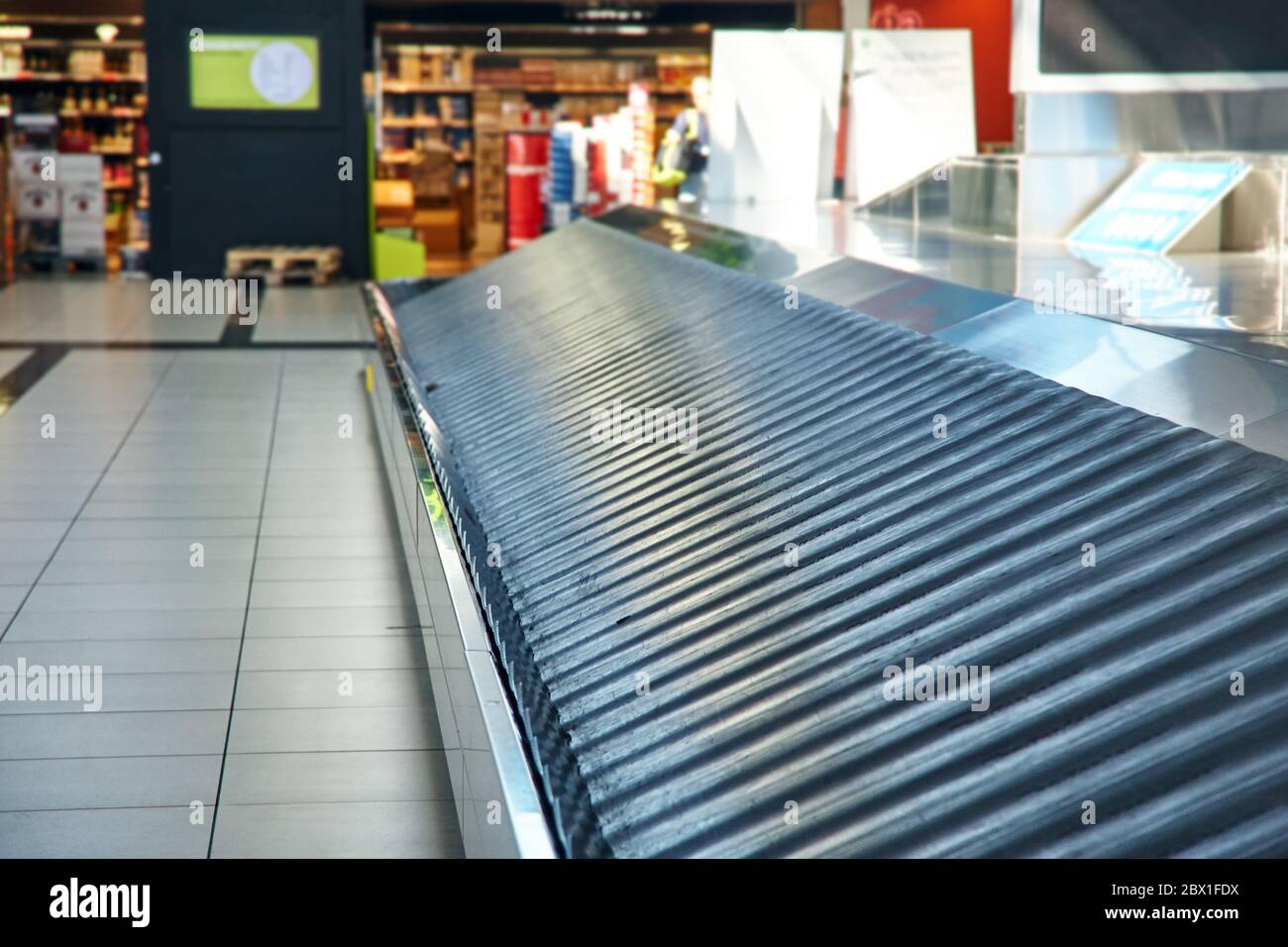 Empty conveyor belt at baggage claim at airport. Stock Photo