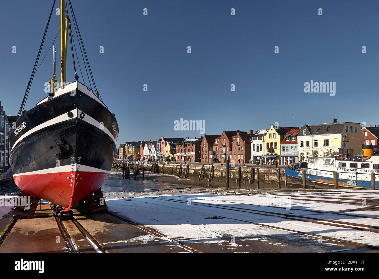 The fishing cutter Hildegard on a slipway in the harbour of Husum. Stock Photo