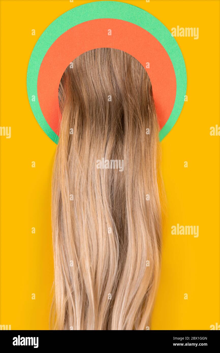 Female long blonde hair peek throught circle in yellow background. Trendy geometrical style copyspace. Vibrant colors. Sales proposal finance and business fashion concept. Salon treatment Stock Photo ...