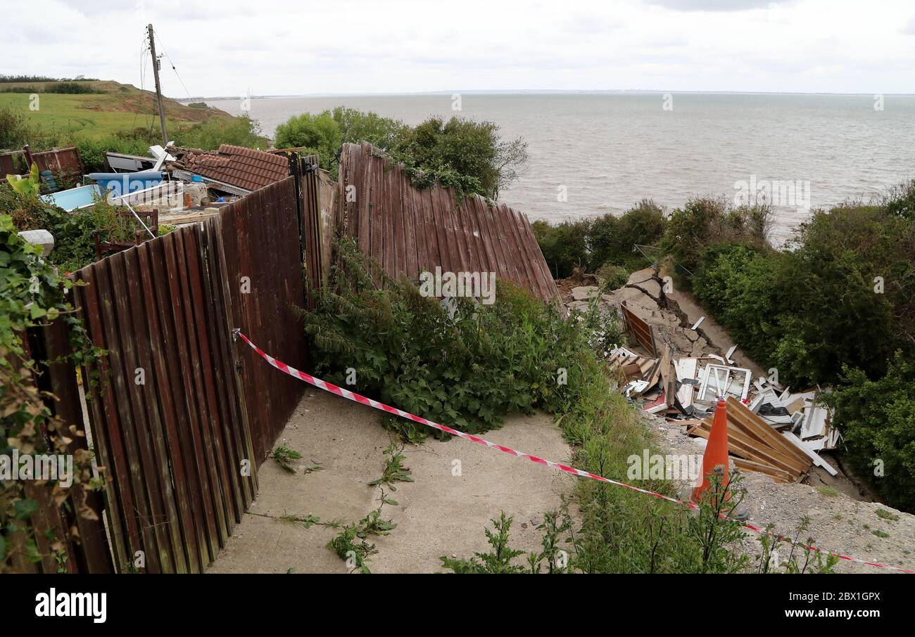 The scene in Eastchurch, Kent, following a landslip last week which caused a bungalow, named Cliffhanger, to collapse towards the sea putting a number of other properties at risk and the owners being evacuated. Stock Photo