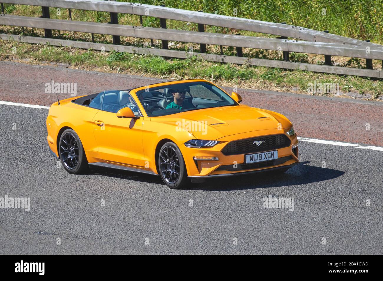2019 orange Ford Mustang Ecoboost Auto; Vehicular traffic moving