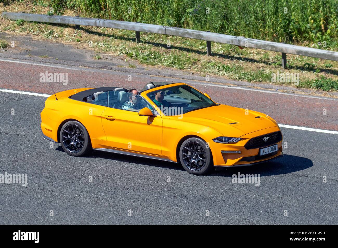 2019 orange Ford Mustang Ecoboost Auto; Vehicular traffic moving