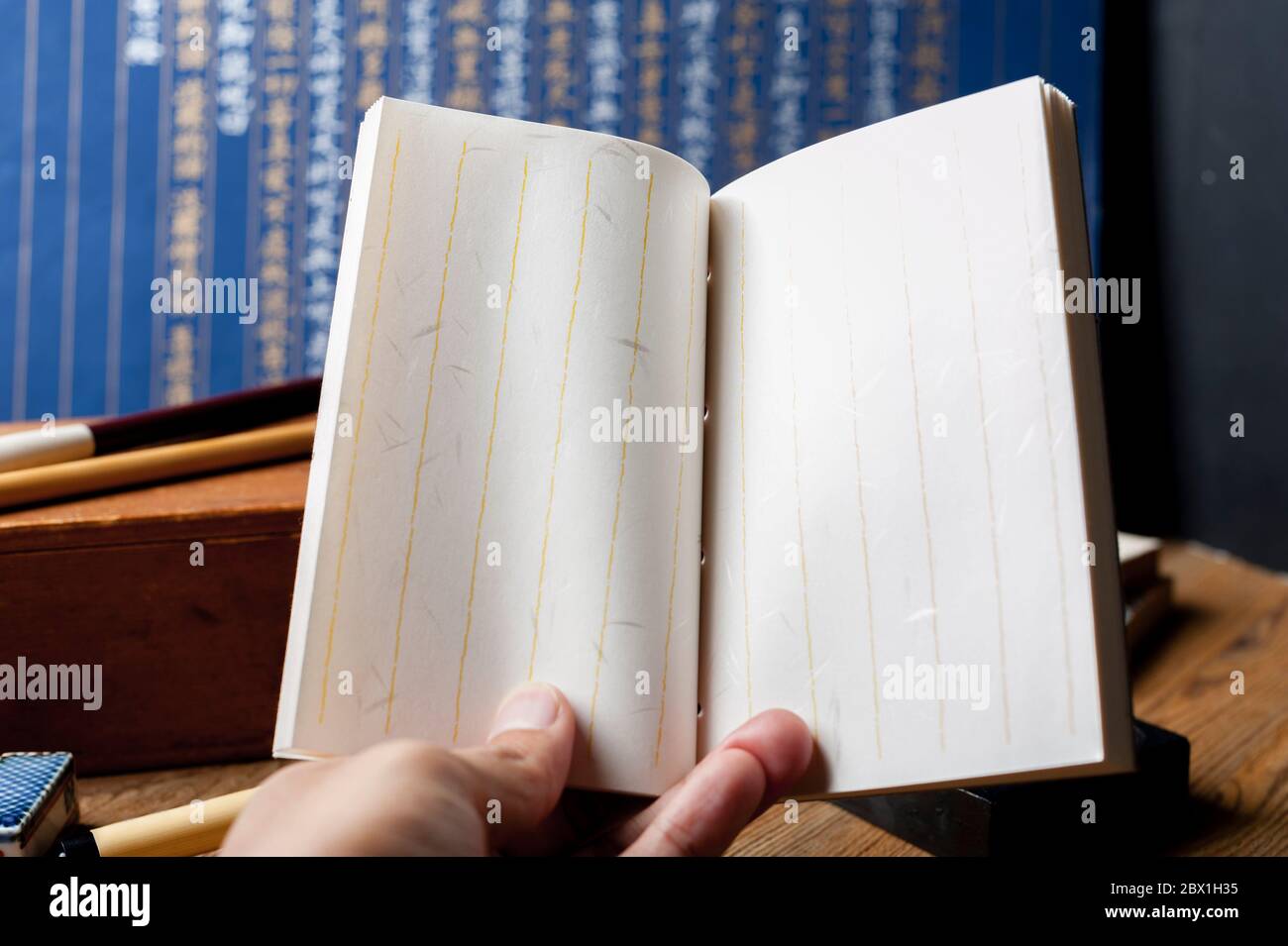Closeup vintage style of Japanese stab binding in hand. Reading a book ...