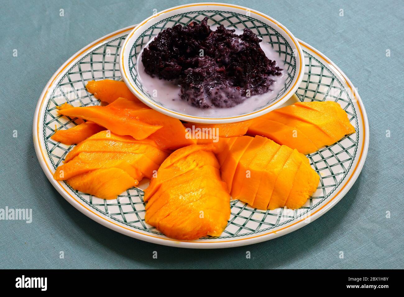 Dessert dish of coconut black rice with fresh mango Stock Photo Alamy