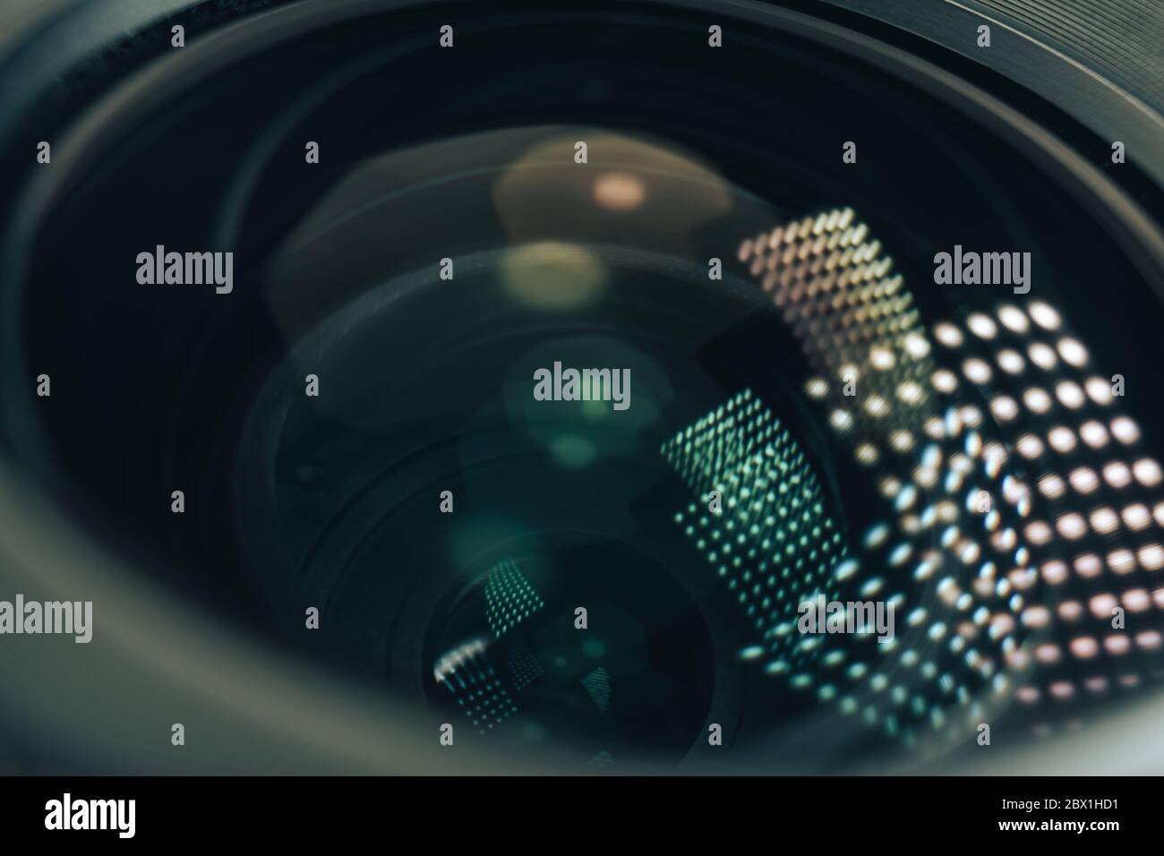 Close up beautiful camera aperture lens with multi colored light glass reflection. Macro view. Stock Photo