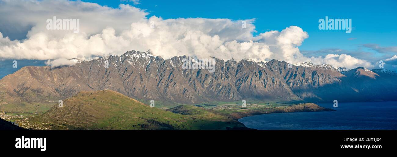 Panorama, view of The Remarkables mountain range with snow covered peaks, Otago, South Island, New Zealand Stock Photo