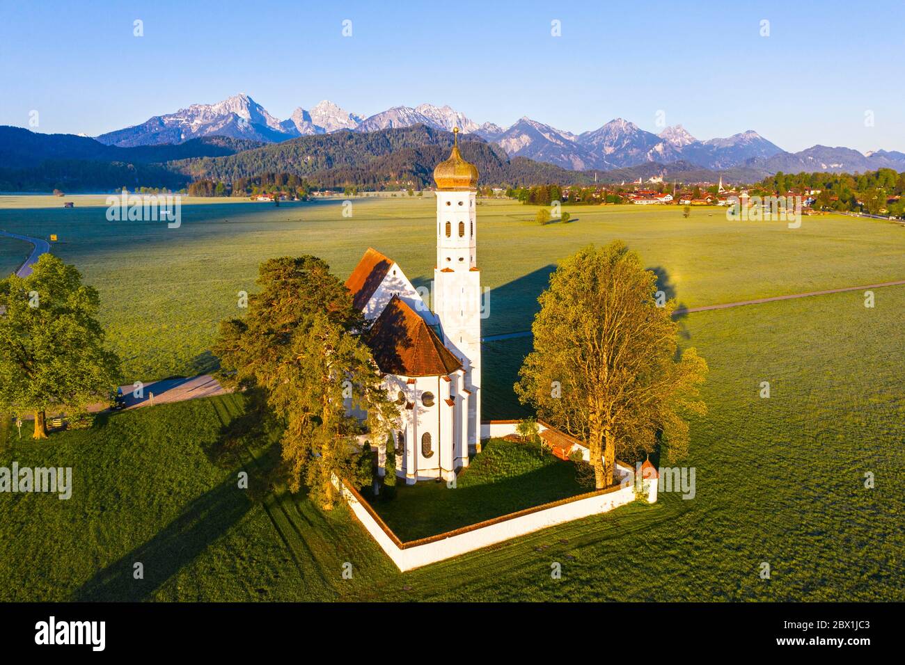 Church St. Coloman, near Schwangau, in the back the Tannheimer mountains, drone picture, East Allgaeu, Allgaeu, Swabia, Bavaria, Germany Stock Photo